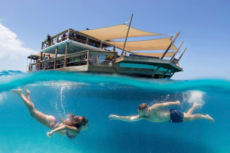 Tourists enjoying swiming on Cloud 9 in Fiji